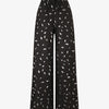 Pantalon élastiqué imprimé plumes irisées - Noir