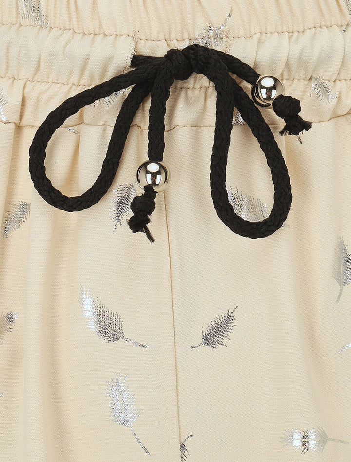 Pantalon élastiqué imprimé plumes irisées - Beige
